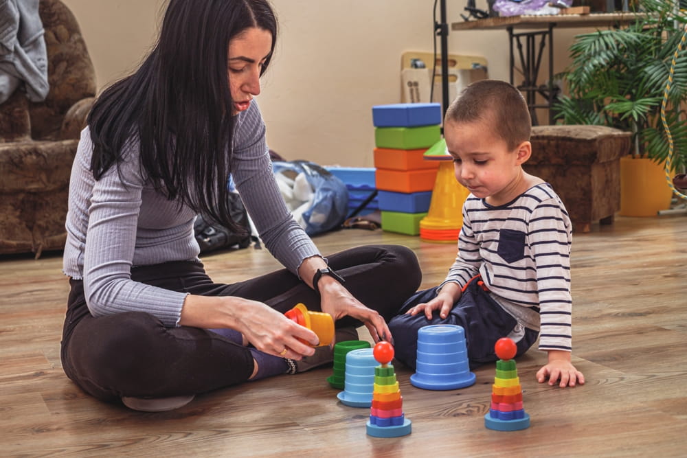 Sensory Integration Therapy Neurocorrection Session for Child with Specialist, Mom is working with her son